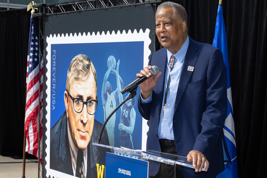 Former basketball player Jamaal “Silk” Wilkes speaks at the John Wooden stamp dedication ceremony.
