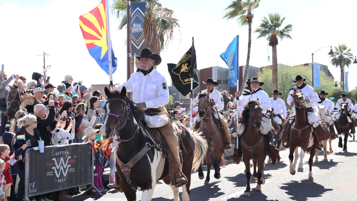 A group of horseback riders re-create the Pony Express