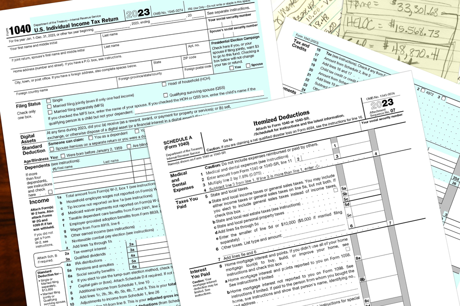 Several types of IRS tax return forms scattered on a flat surface
