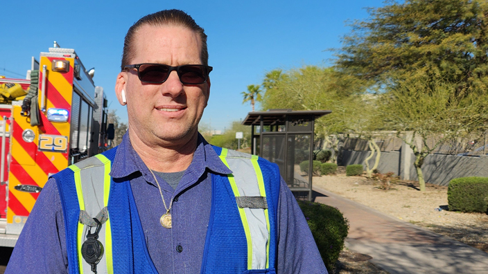 Phoenix Tractor Trailer Operator Todd Will wearing a blue safety vest