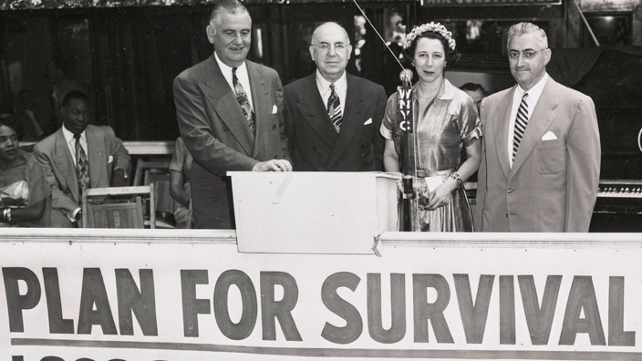 New York City Postmaster Albert Goldman, second from left, pictured along with other participants at a civil defense volunteer drive in the 1950s.