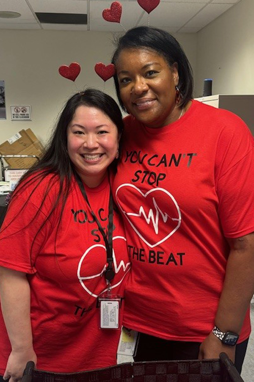 Amy Cheng, left, and Sherry Wyatt wear their red T-shirts at the recent Texas 2 District health fair.