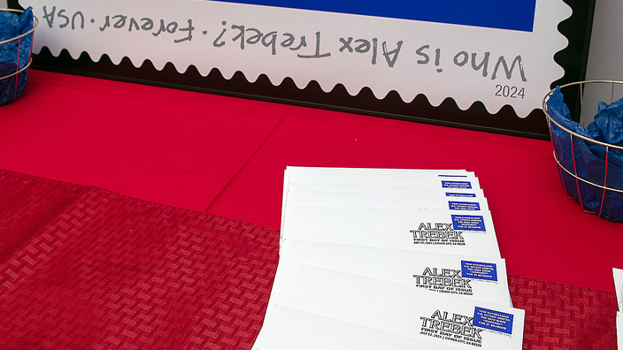 Souvenir envelopes are displayed at the Alex Trebek stamp dedication ceremony on July 22.