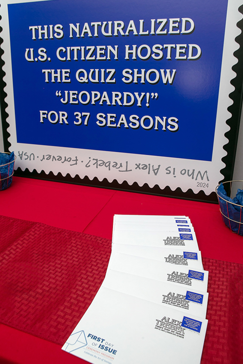 Souvenir envelopes are displayed at the Alex Trebek stamp dedication ceremony on July 22.