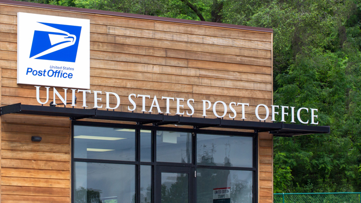 The outdoor entrance to a U.S. Post Office
