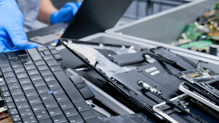 Person handling old computer equipment