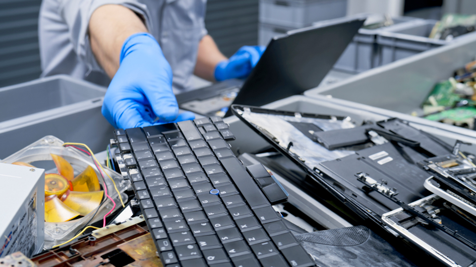 Person handling old computer equipment