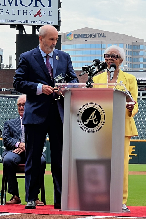 Tom Marshall, the Postal Service’s general counsel, stands next to Billye Suber Aaron during the stamp dedication ceremony.