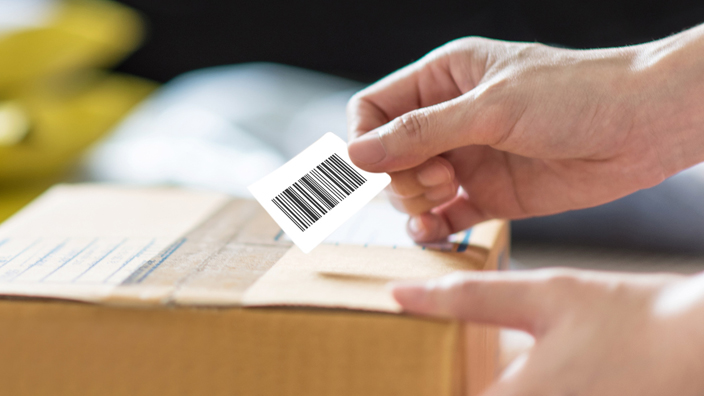 A customer prepares to mail a package