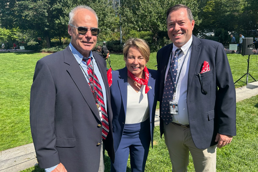 Participants in a National Day of Service and Remembrance care package event included, from left, Paul Bolas, a USPS senior territory sales executive; Massachusetts Gov. Maura Healey; and Brian Cronin, a Boston customer services manager.