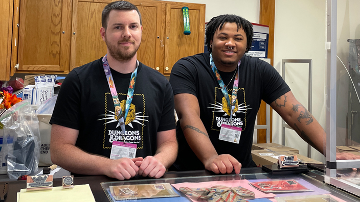 Xavier Davis, right, and Troy Moore, Kansas City, MO, stamp fulfillment services clerks, work at the USPS booth at Gen Con, the gaming conference where the Dungeons & Dragons stamps were dedicated in August.