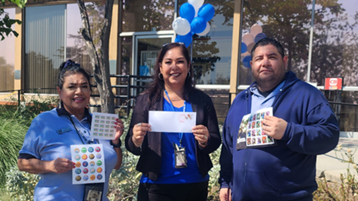 USPS employees gather outside the Sierra Madre, CA, Post Office during the “date meets ZIP” festivities. From left are Elizabeth Ascencio, retail associate; Anna Rodriguez, postmaster; and Christopher Estrada, retail associate.