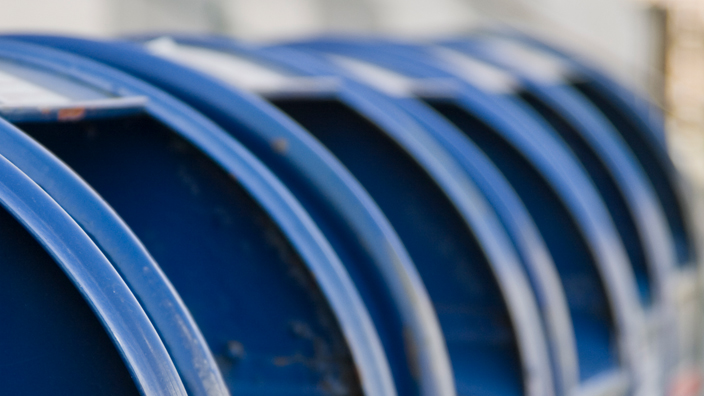 A row of USPS blue collection boxes