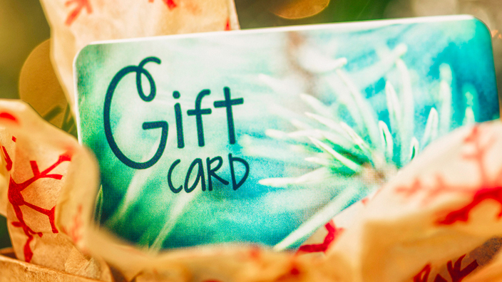 A close up of a holiday gift card