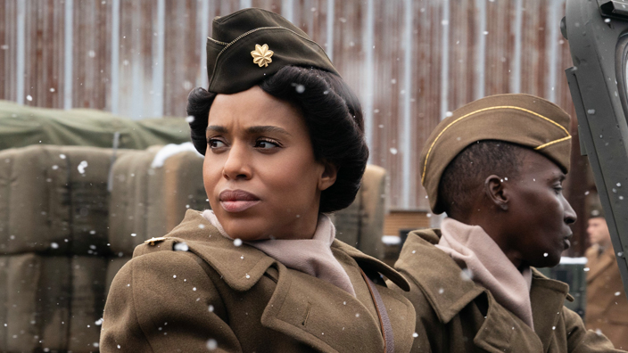 Actress Kerry Washington wearing a World War Two-era U.S. Army uniform and sitting in a Jeep