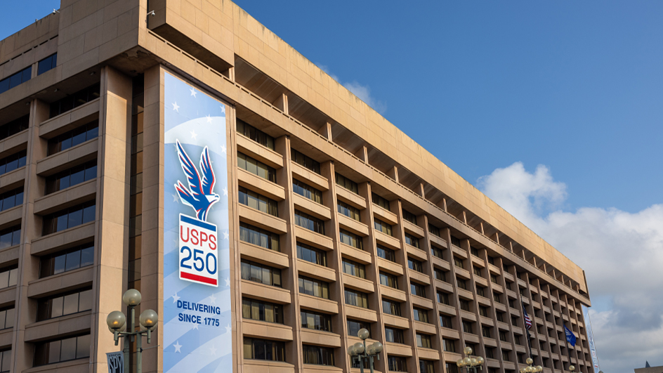 The same banner as the previous photo hangs on the opposite end of the building