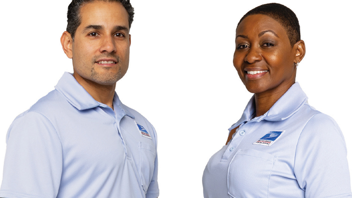 A man and woman wear Postal Service uniforms in a studio