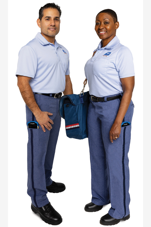 A man and woman wear Postal Service uniforms in a studio