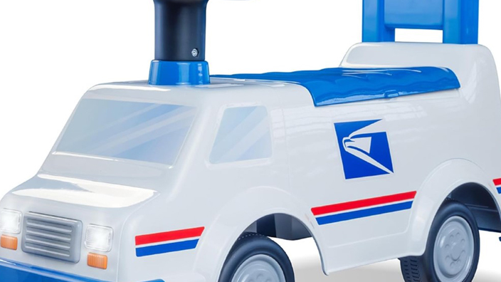 A colorful ride-on toy that resembles a USPS delivery vehicle