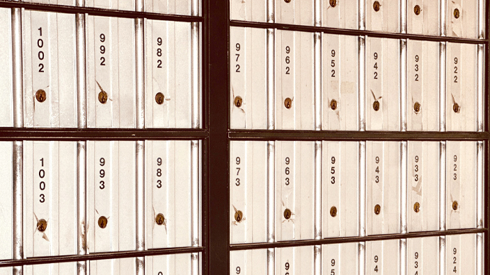 A bank of PO Boxes inside a Post Office