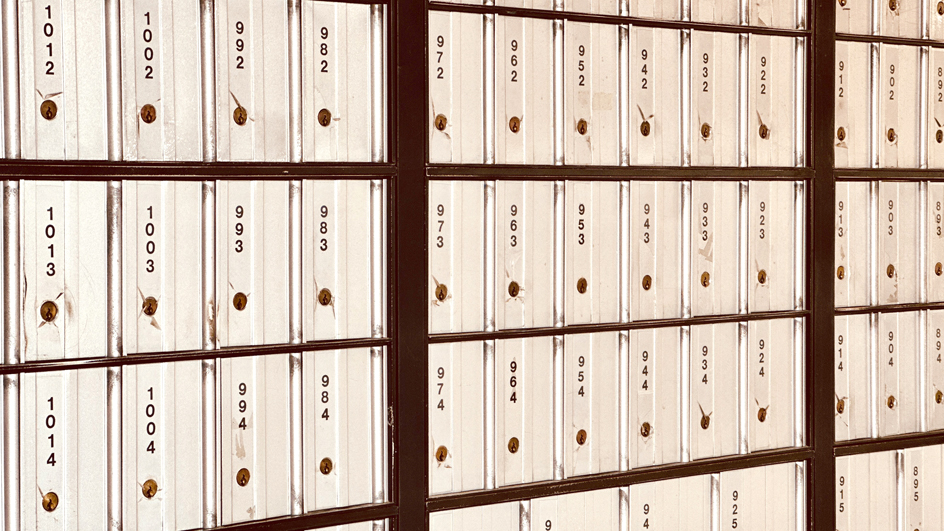 A bank of PO Boxes inside a Post Office