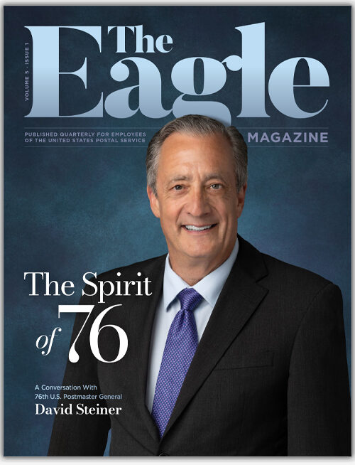 The cover page of the Eagle magazine showing a man in a dark suit and blue tie.