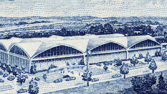 A stamp depicting an illustration of a mid-century Post Office building