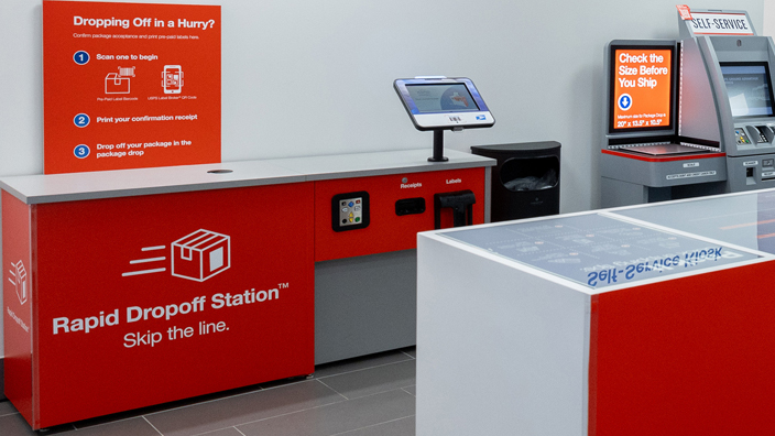 A modern Post Office retail lobby featuring several self-service stations