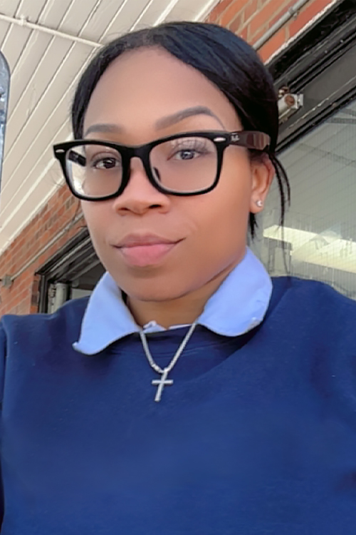 A young woman wearing a blue sweat shirt