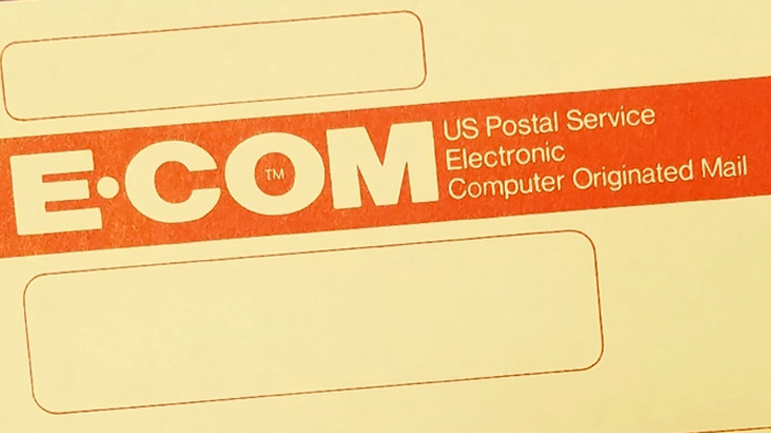 The E-COM logo