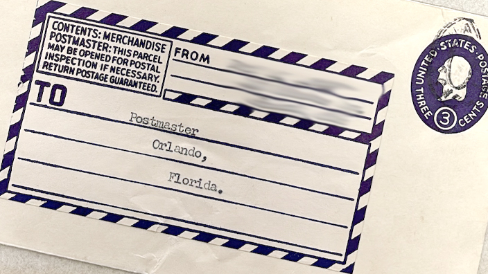 A typewritten letter and 1950s envelope