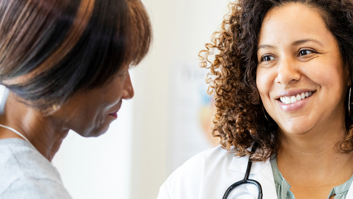 A female doctor speaks to a patient