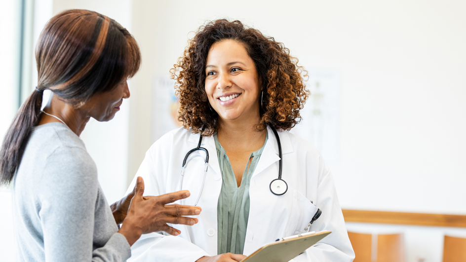 A female doctor speaks to a patient