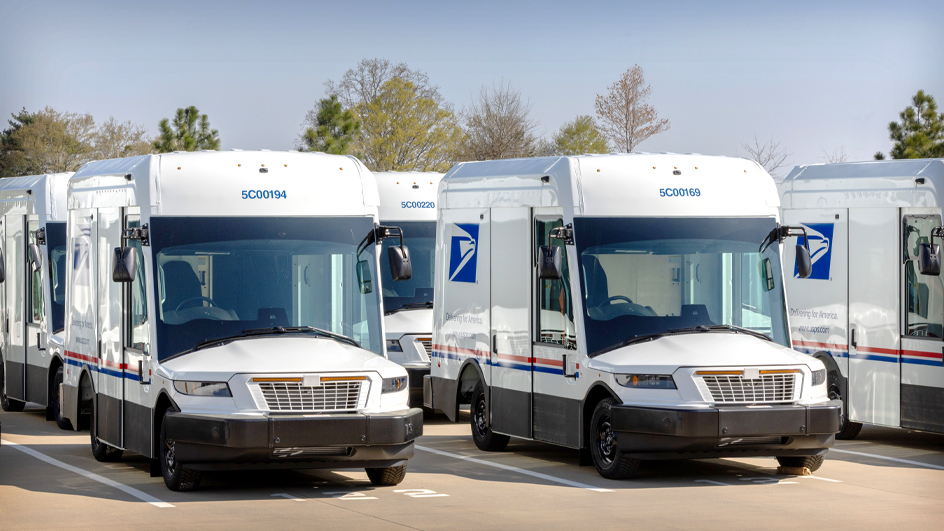 A row of USPS delivery vehicles