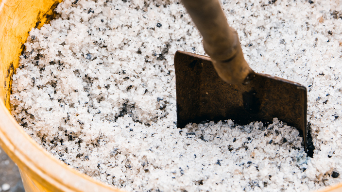 A bucket of deicing material