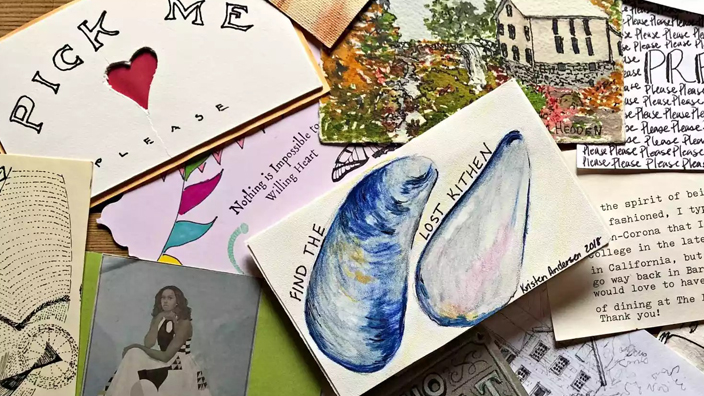 A collection of postcards fanned out on a tabletop