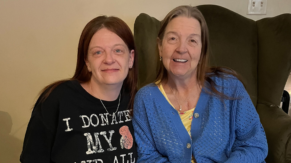 Mother and daughter sitting side-by-side