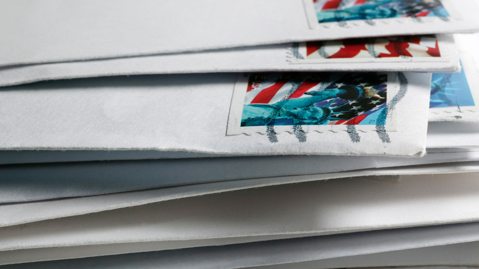 A close-up of a stack of envelopes