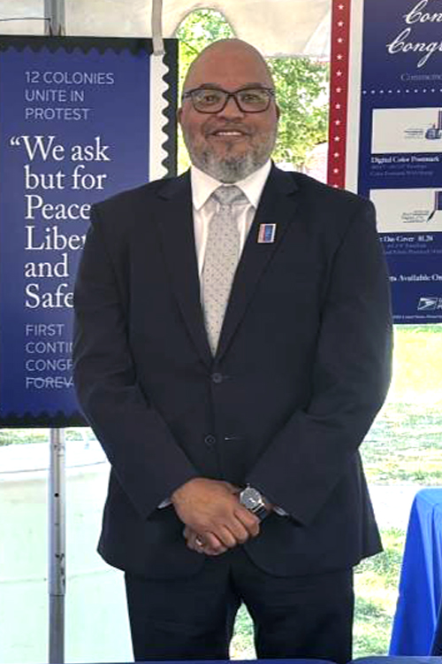 Man wearing a black suit