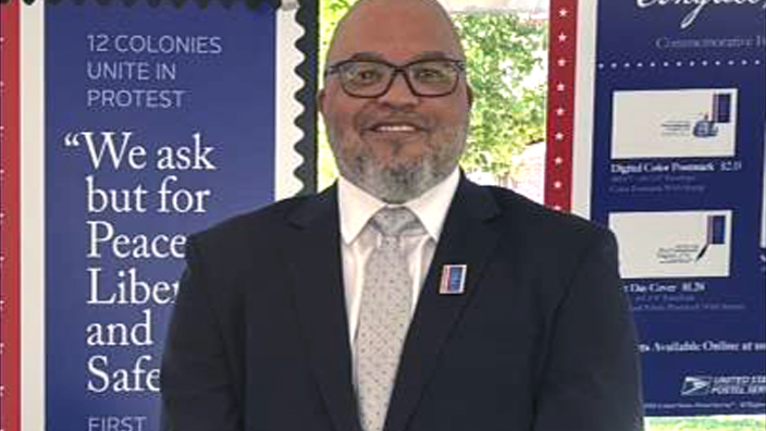 Man wearing a black suit