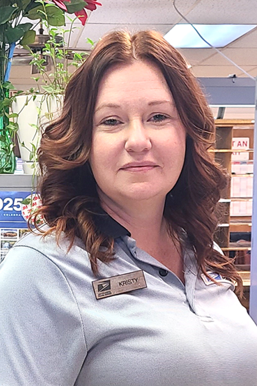 A woman wearing a blue polo shirt