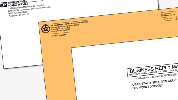 Three printed envelopes stacked on one another