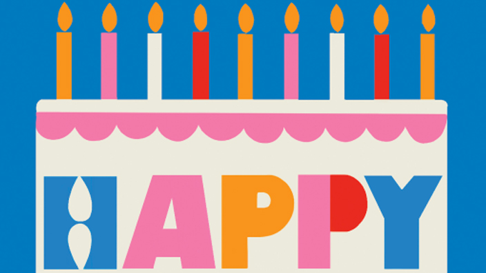 A postage stamp that shows a stylized image of a white birthday caked on a blue background.