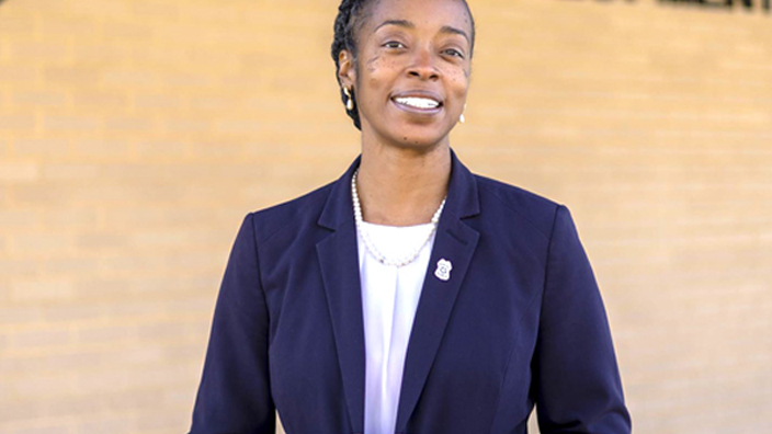 Person standing outside the U.S. Postal Inspection Service Career Development Unit building