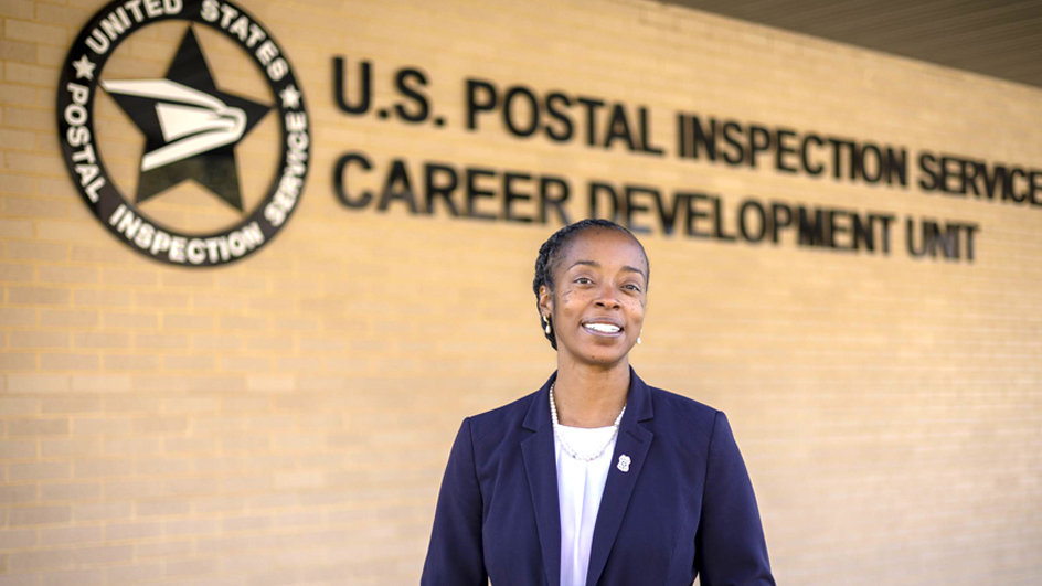 Person standing outside the U.S. Postal Inspection Service Career Development Unit building
