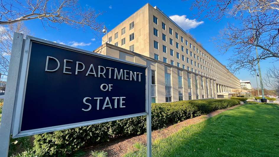 Sign reading “Department of State” outside of the department’s headquarters building in Washington, DC