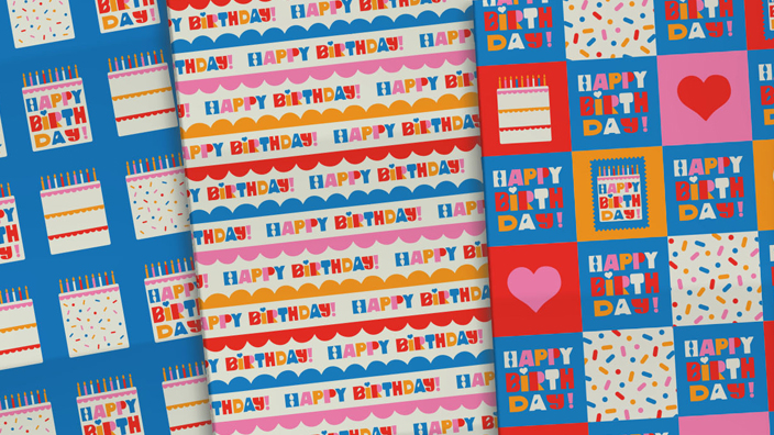 Four sheets of Happy Birthday stamp-themed wrapping paper in pink, blue, orange and white