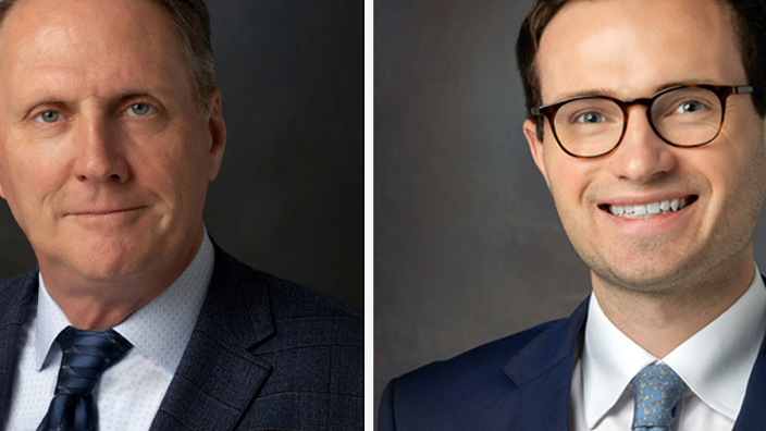 Side-by-side portraits of two men wearing suits and ties against a dark backdrop