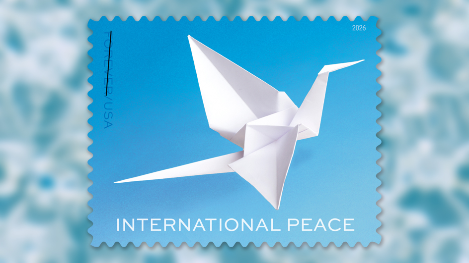 The USPS International Peace stamp shows a white paper crane on a blue background.