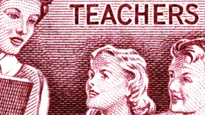 Postage stamp image showing a teacher and two children